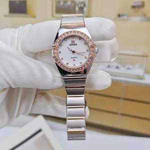 Women quartz watch with rhinestone bezel, stainless steel and rose gold tone bracelet.