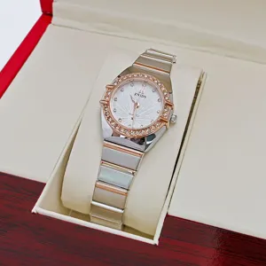 Close-up detail shot of a luxury women's quartz watch featuring a crystal bezel and elegant dial.