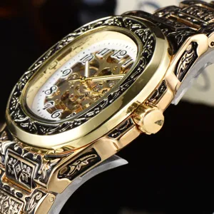 Men's vintage hollow mechanical watch with gold stainless steel embossed carved strap.