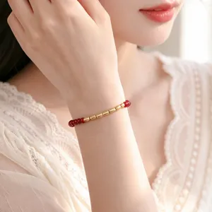 Neues chinesisches Zinnober und 999er Silber goldne Reisperlen Armband fur Damen.