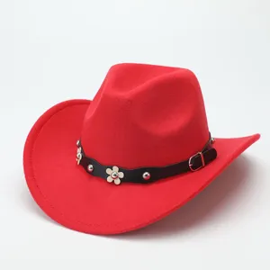 Red wool felt cowboy hat detail, showing curved brim, black leather belt, and metallic flower studs.