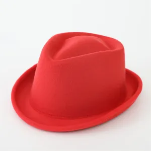 Red felt fedora hat detail, retro British style jazz hat for men and women close up view.