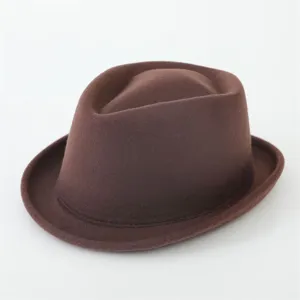 Closeup detail of a classic brown woolen fedora hat, vintage British style men women jazz hat.
