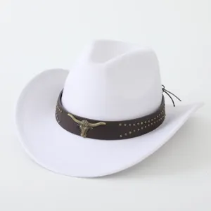 Detail view of a white western cowboy hat featuring a brown studded leather band and bull skull.