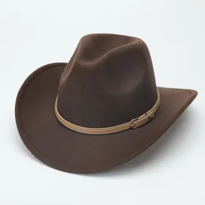 Brown felt cowboy hat close-up showing fine texture, leather strap detail and metal buckle.