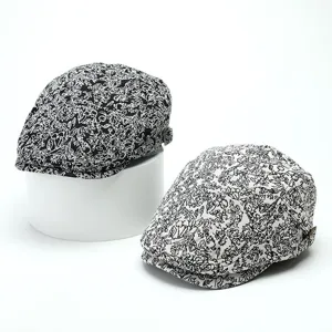 Detailed view of the vintage jacquard ivy cap with intricate floral pattern and side buckle.