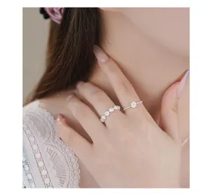 Exquisite S999 sterling silver daisy flower ring detail shot, minimalist design for women.