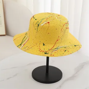 Yellow splatter paint straw hat for women men, stylish flat top sun protection beach hat.