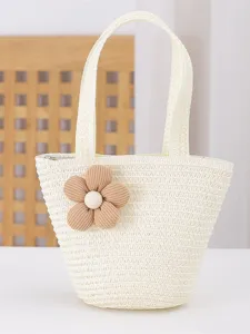 Chic straw woven tote bag for women with cute flower decoration, perfect for summer beach.