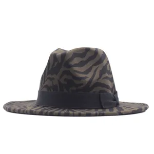 Detailed view of a stylish zebra print fedora hat with black ribbon bow, high quality fabric.