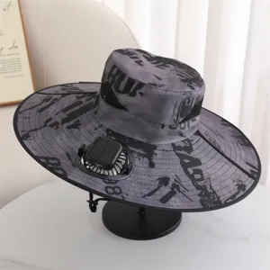 Detailed view of the solar-powered fan fishing hat, grey camouflage print, wide brim sun protection.