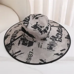 Outdoor sun protection wide brim fisherman hat with abstract graffiti print and breathable mesh.