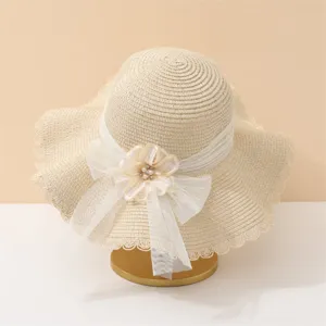Sommer grosser Krempe Strohhut Sonnenhut mit weisser Schleife und Perle Blume für Strand.