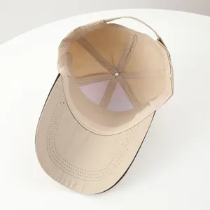 Detailed interior view of khaki baseball cap showing high-quality stitching and structure.