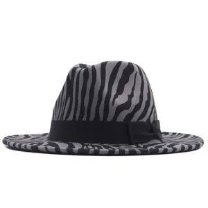 Detailed view of the stylish zebra print fedora hat with black ribbon bow decoration.