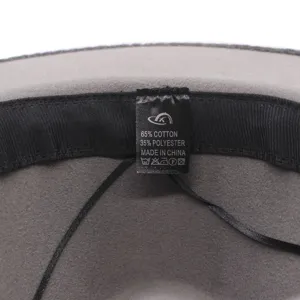Detailed view of the hat's inner material tag, showing 65% cotton and 35% polyester blend.