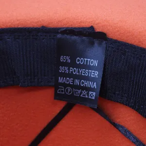Detaillierte Ansicht des inneren Waschetikets des Damen Wollhut mit Material und Herkunft.