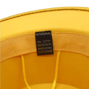 Gelber Woll-Jazzhut Innendetail mit Etikett für 65% Baumwolle und 35% Polyester Material.