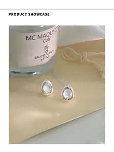 Elegantes pendientes de plata esterlina S925 con gema irregular, diseño de nicho de lujo.