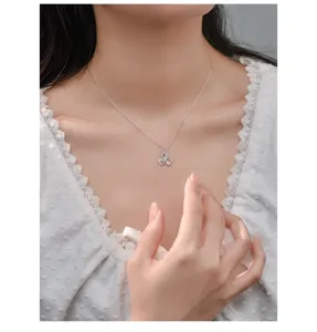 Delicate silver clover pendant necklace for women, elegant clavicle chain detail shot.