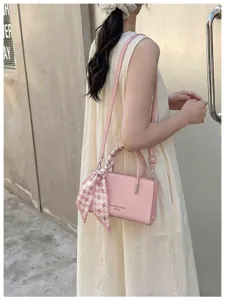 Pink crossbody shoulder bag for women, elegant textured PU leather square handbag with scarf.