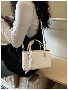 Trendy women's shoulder crossbody bag with scarf decoration, stylish crocodile pattern design.