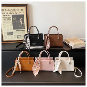 Stylish women's shoulder bag with scarf accessory, crocodile pattern tote handbag for daily fashion.
