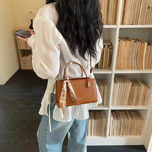 Stylish women shoulder bag spring summer trendy small square handbag with chic scarf decoration.