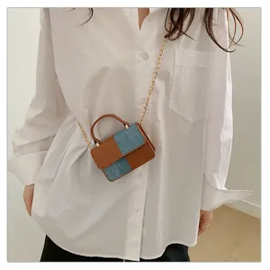 Retro colorblock mini shoulder bag for women, stylish denim and PU leather messenger bag.