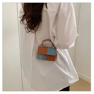 Vintage colorblock shoulder crossbody bag detail, stylish mini handbag with chain and handle.