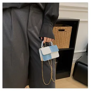 Detail shot of mini color block crossbody shoulder bag for women with gold chain.