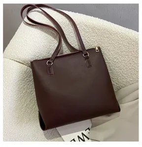 Detailed view of the dark brown women large capacity shoulder tote bag with long straps.