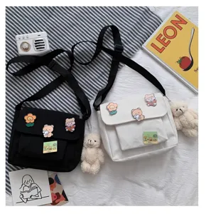 Japanese Harajuku style canvas crossbody bag for women, cute shoulder bag with bear charms.