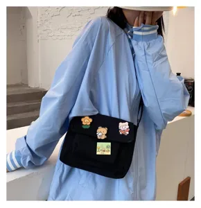 Cute Harajuku canvas crossbody bag with lovely cartoon badges for daily casual student wear.