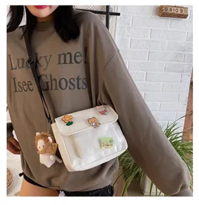 Ins style cute canvas crossbody bag for women, Japanese harajuku shoulder bag with charms.