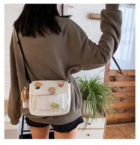 Japanese Harajuku white canvas crossbody bag for women, cute pins and plush pendant casual bag