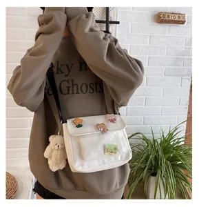 White canvas crossbody bag for women, Japanese Harajuku style shoulder bag with cute pins.