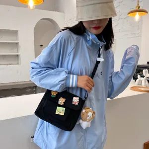 Cute Japanese Harajuku canvas crossbody bag for women, casual student shoulder bag with pins.