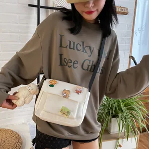 Cute canvas crossbody bag for women, Japanese Harajuku style shoulder bag with badges.