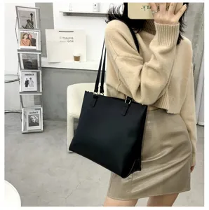 Large capacity black shoulder tote bag for women, chic minimalist design for daily commute style.