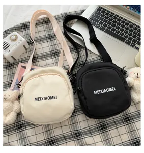 Detailed view of the cute casual canvas crossbody bag, featuring solid color and adjustable strap.