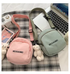 Cute canvas crossbody bag for women, Korean style fashion single shoulder bag with cute bear pendant.