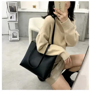 Stylish black PU leather large capacity tote bag for women, perfect for daily wear and work.