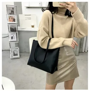 Black large capacity shoulder tote bag for women, stylish minimalist daily commute handbag.