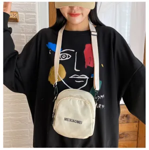 Korean style canvas crossbody bag for women, stylish casual shoulder bag with adjustable strap.