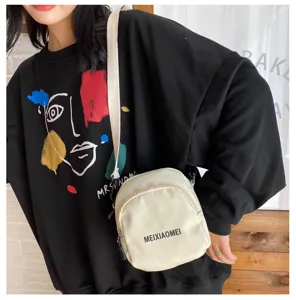 Korean style canvas crossbody bag for women, cute casual shoulder bag with zipper pocket.