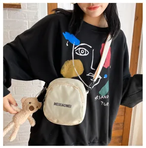 Women canvas crossbody shoulder bag with cute bear charm, casual fashion daily use.