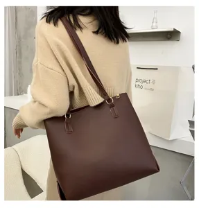 Dark brown leather shoulder tote bag detail view, minimalist style, large capacity, chic.