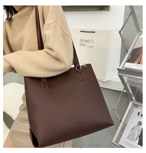 Elegant dark brown shoulder tote bag detail, minimalist large capacity design for women daily wear.