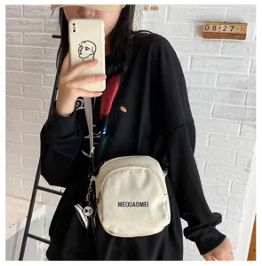 Korean style fashion canvas crossbody bag for women, casual white shoulder bag, daily use.